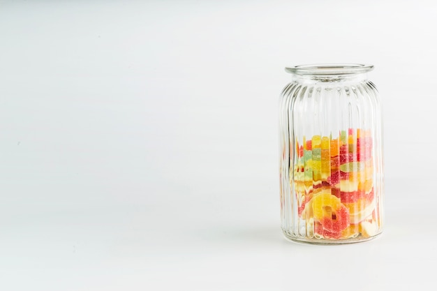 Free photo glass jar with jelly candies