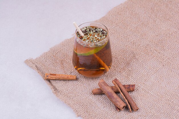 A glass of juice with herbs and spices