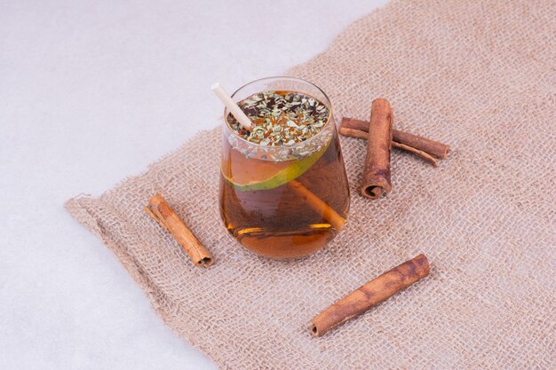 A glass of juice with herbs and spices