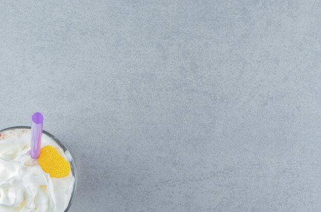 A glass of lemon milkshake on the marble background. High quality photo