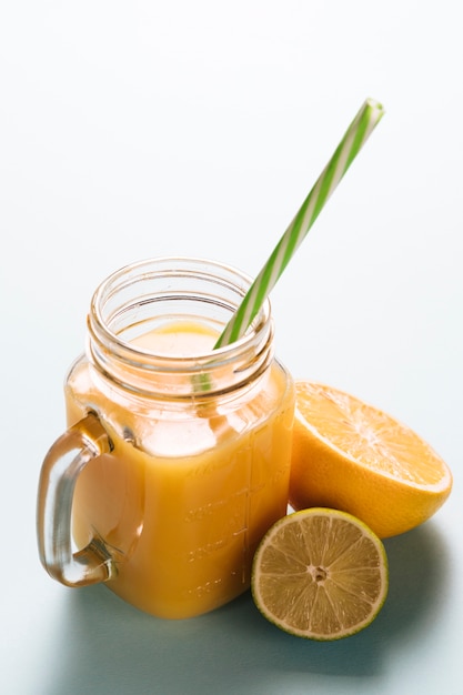 Free photo glass of lemonade on plain background