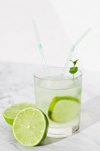 Glass of lime drink on table