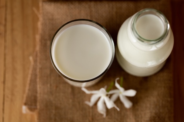 glass of milk and a bottle of milk top view