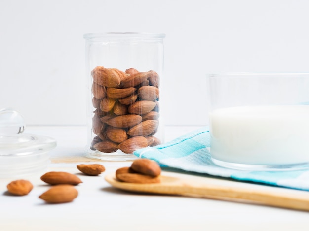 Free photo glass of milk with almonds