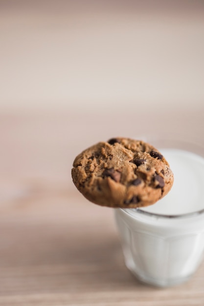 Glass of milk with chocolate chip cookies