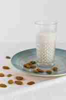 Free photo glass of milk with nuts