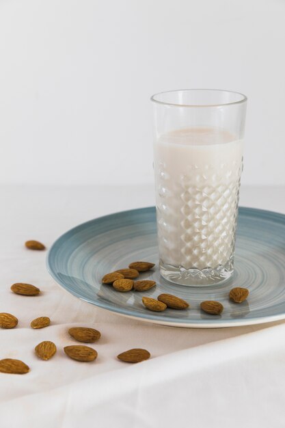 Glass of milk with nuts