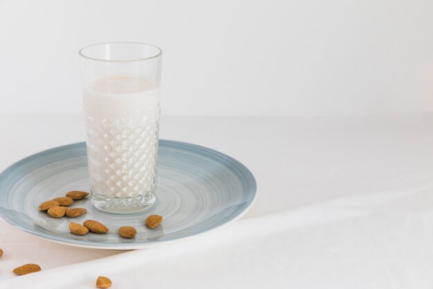 Glass of milk with nuts