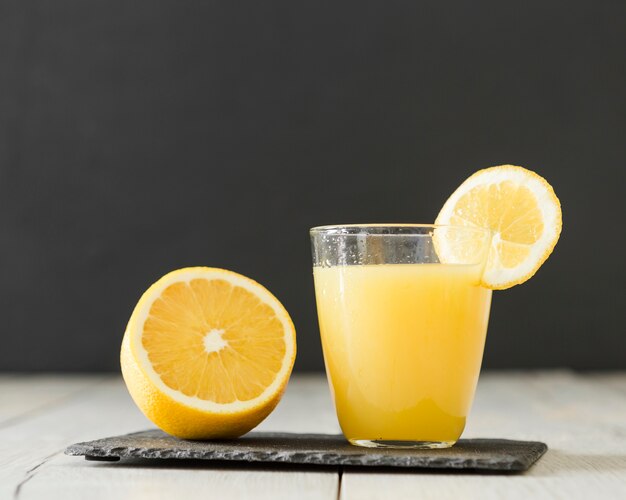 Glass of orange juice of slate board