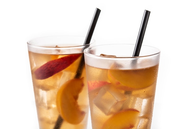 Free photo glass of peach tea with ice cubes