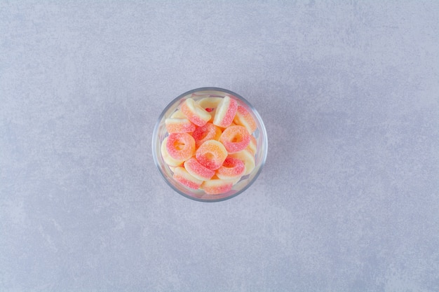 A glass plate full of colorful fruit sugary marmalades 