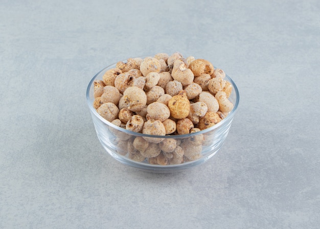 A glass plate full of delicious round food . 