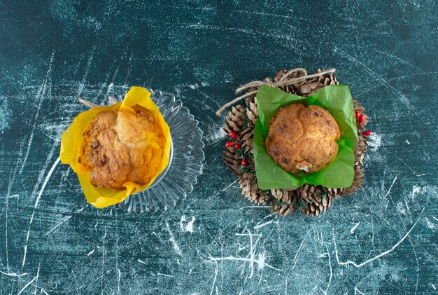 A glass plate with muffins and Christmas wreath. High quality photo