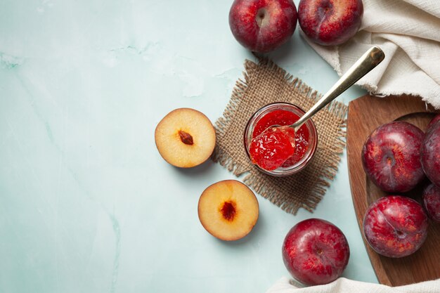 glass of plum put on white marble floor