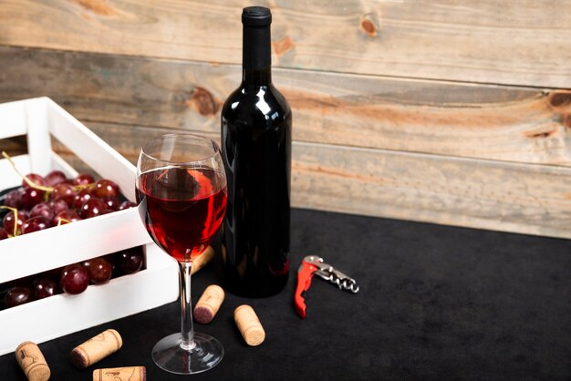 Glass of red wine with wooden background