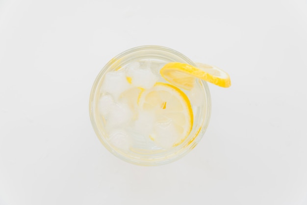 Glass of refreshing cold drink with lemon