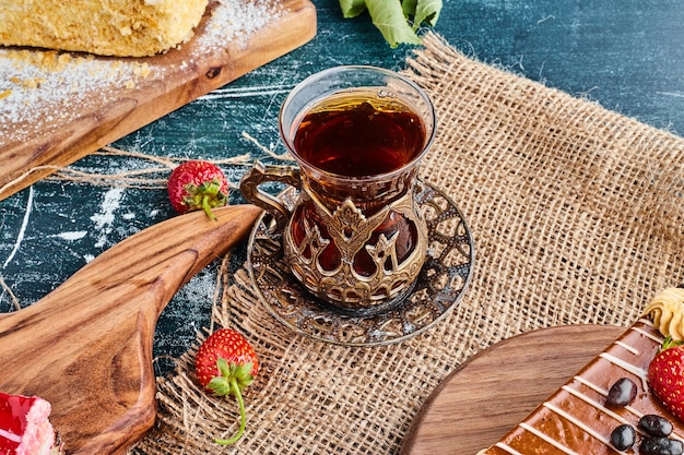 A glass of tea on a piece of burlap. 