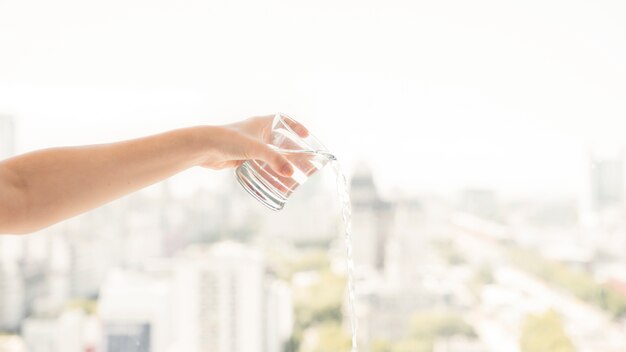 Glass of water being spilled