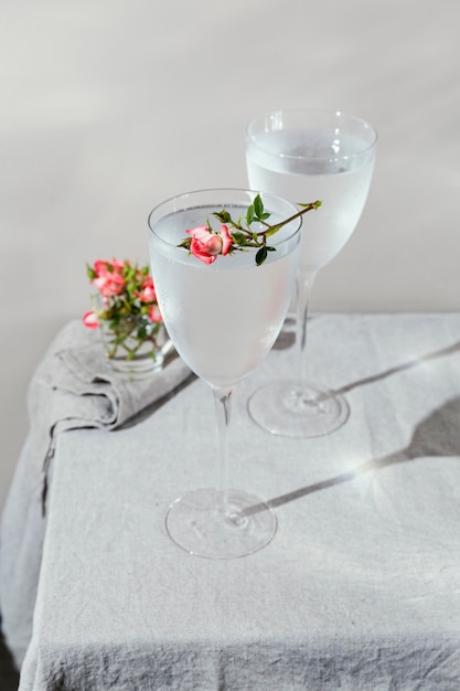 Glass of water with flower petals