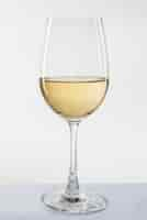 Free photo glass of white wine on white background