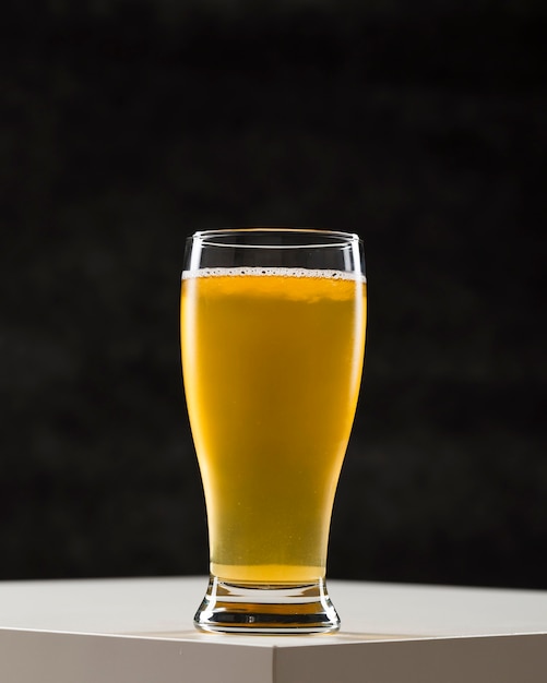 Glass with beer on desk