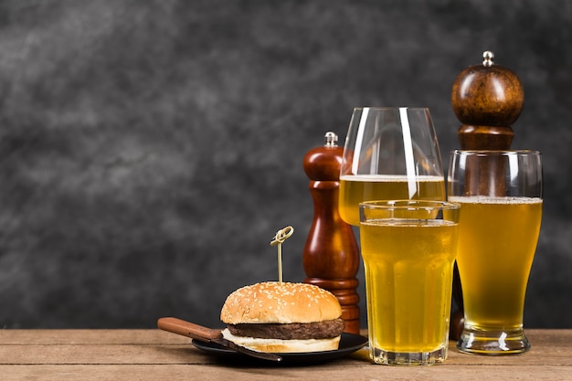 Glass with beer and hamburger