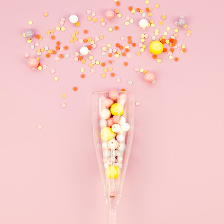 Free Photo glass with christmas balls and glitter