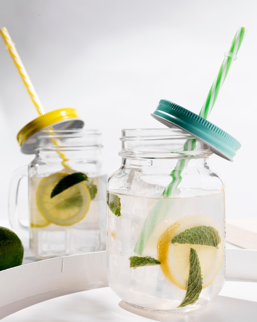 Glass with citrus fresh drink on tray