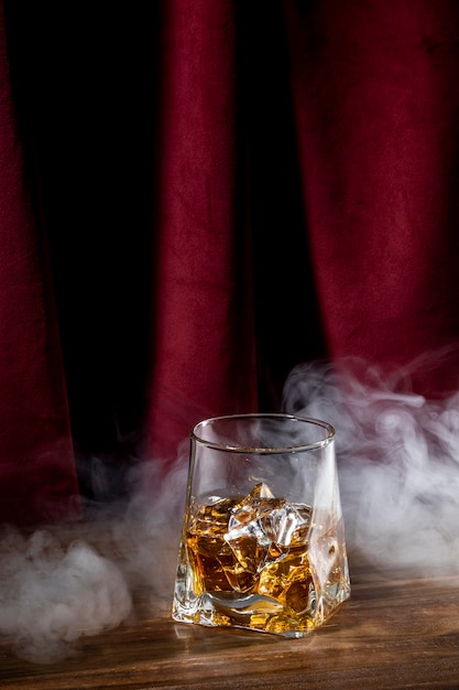 Glass with drink and smoke