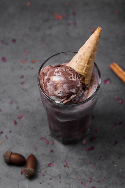 Glass with flavored ice cream and cone