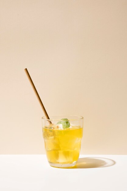 Glass with fresh drink and straw