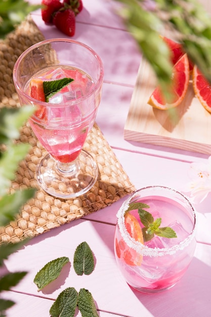 Glass with fresh drinks on table