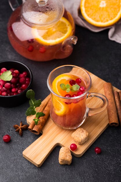 Glass with fruity flavor tea on table