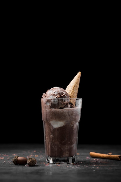 Glass with ice cream and cone served