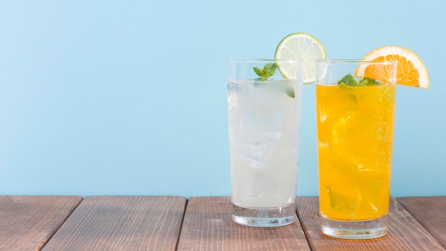 Free photo glass with orange and lemonade drink