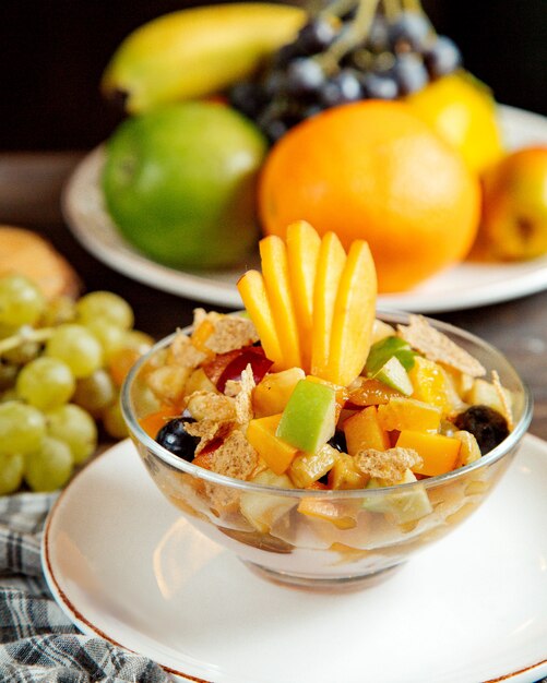 A glass with sliced fruits