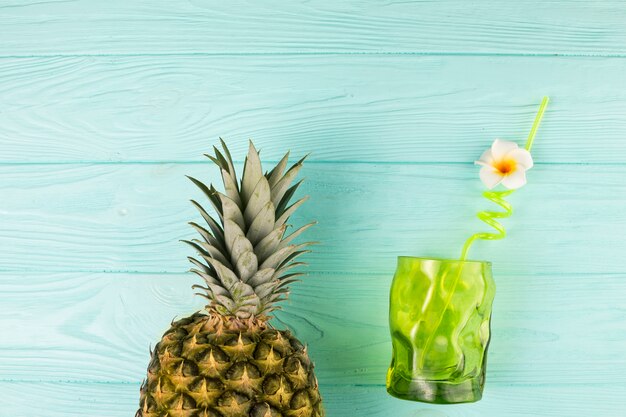 Glass with straw and pineapple