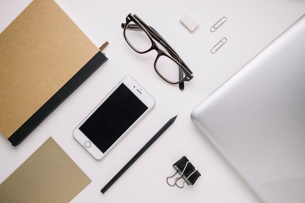 Glasses amidst stationery and technologies