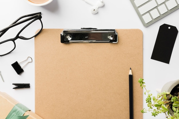 Glasses beside clipboard