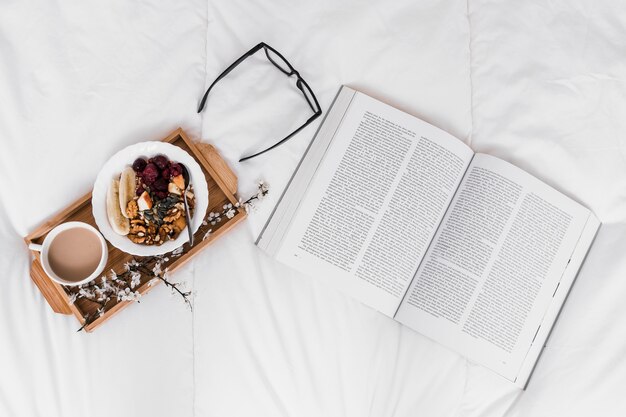 Free photo glasses and book near breakfast food