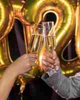 Free photo glasses of champagne being held in hands