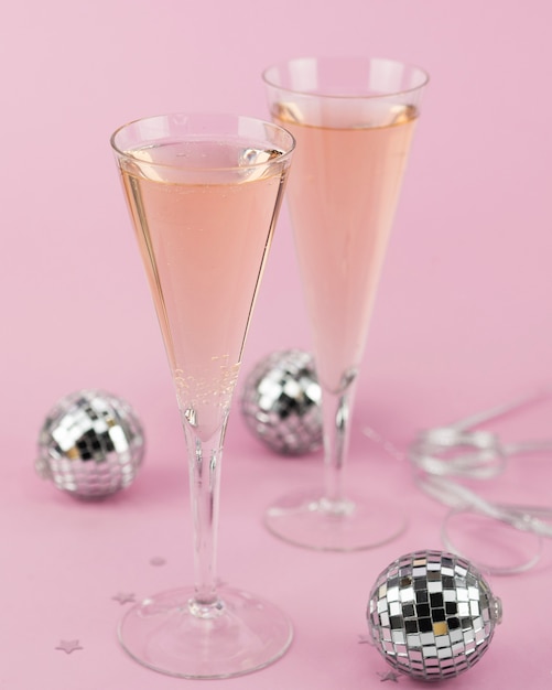 Glasses of champagne with silver globes