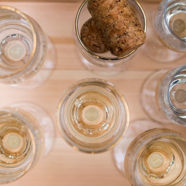 Glasses of champagne on wooden table at outdoors