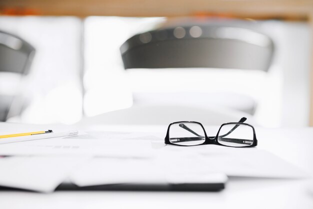 Glasses on desk in office