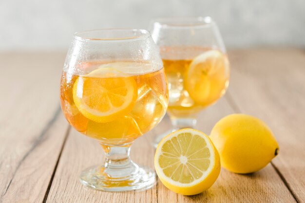 Glasses of drinks with lemon