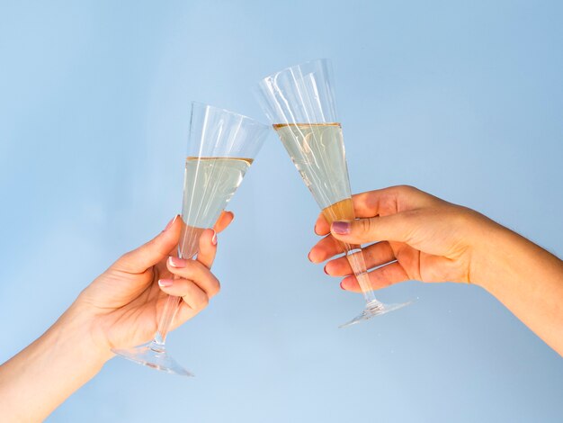 Glasses filled with champagne toasting