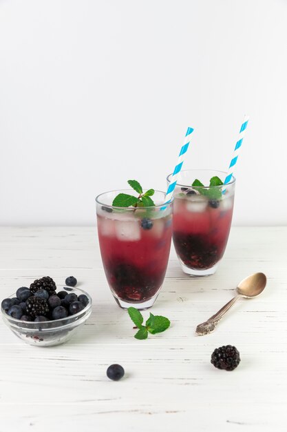 Free photo glasses of fresh iced wild berries
