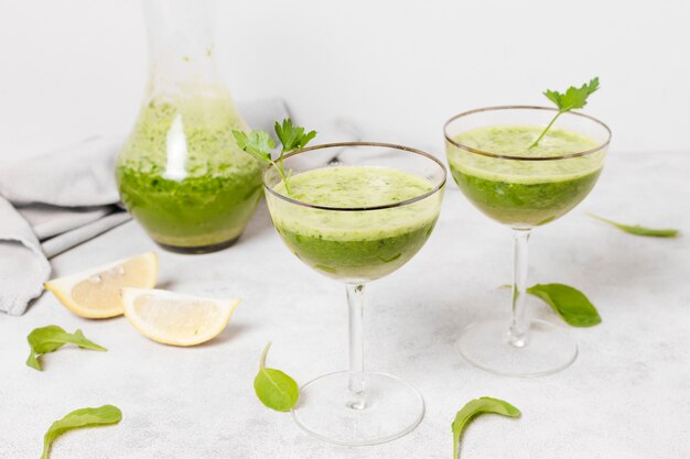 Glasses of healthy smoothies with lemon slices