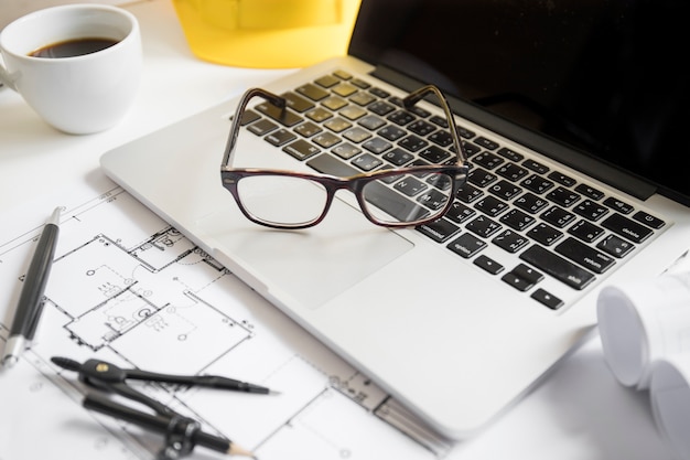 Glasses lying on laptop