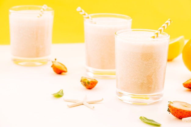 Glasses of milkshake on table